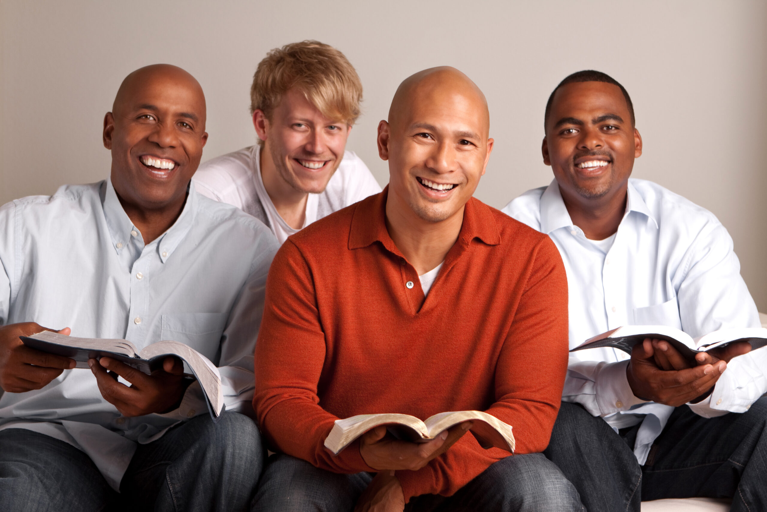 Diverse group of men in a small group.