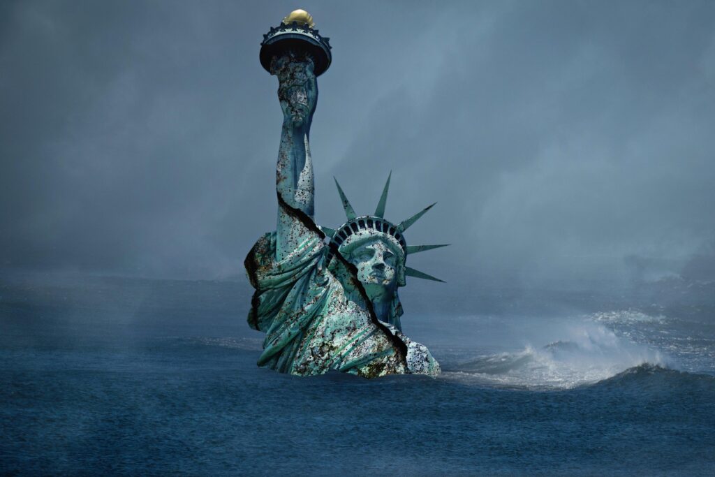 The Statue of Liberty, partially submerged and weathered, symbolizes loss and change amidst turbulent waters and dark skies.