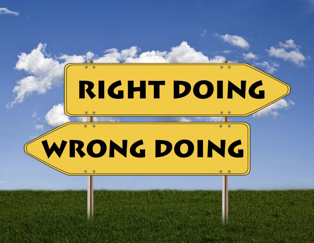 Yellow directional signs display "RIGHT DOING" and "WRONG DOING," symbolizing choices in ethics or morality against a blue sky and green field.