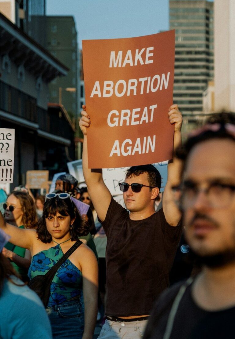 a group of people holding a sign