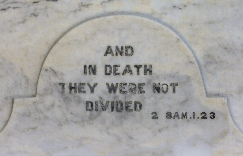 a close up of a memorial with a quote on it